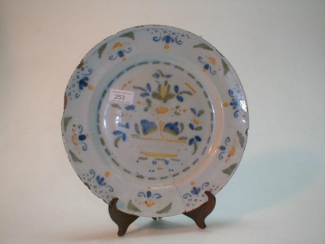 Appraisal: A Delft plate probably Southwark polychrome painted to the well