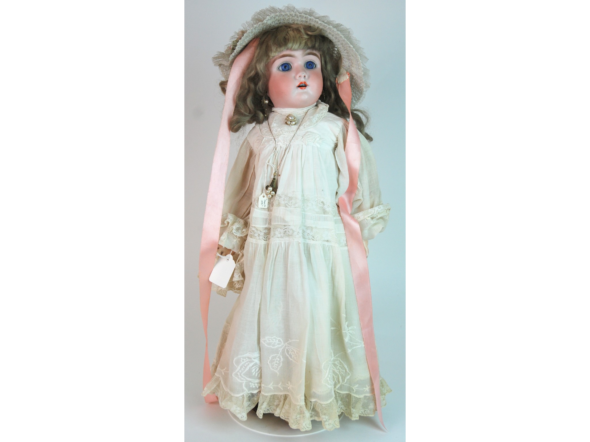 Appraisal: A German bisque-headed dollwith fixed blue eyes open mouth and