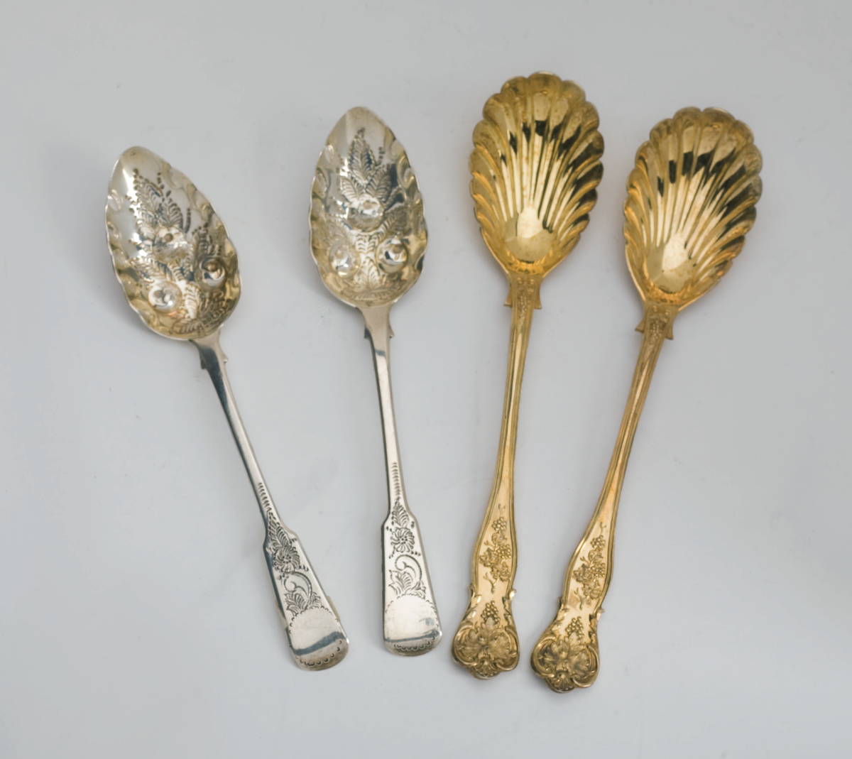 Appraisal: PAIR OF VICTORIAN SILVER-GILT BERRY SPOONS GEORGE W ADAMS LONDON