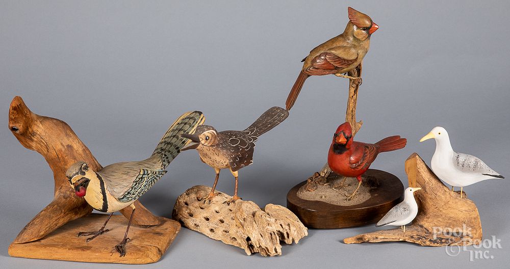 Appraisal: Four carved and painted bird groups Four carved and painted