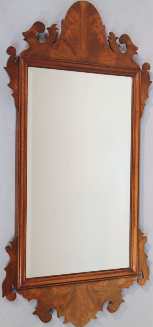 Appraisal: A thC walnut finish pier glass with a shaped outline