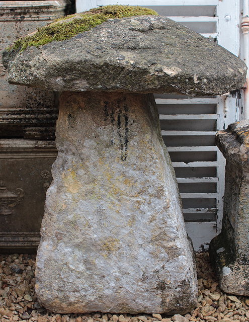 Appraisal: AN OLD STADDLE STONE with circular top and spreading base