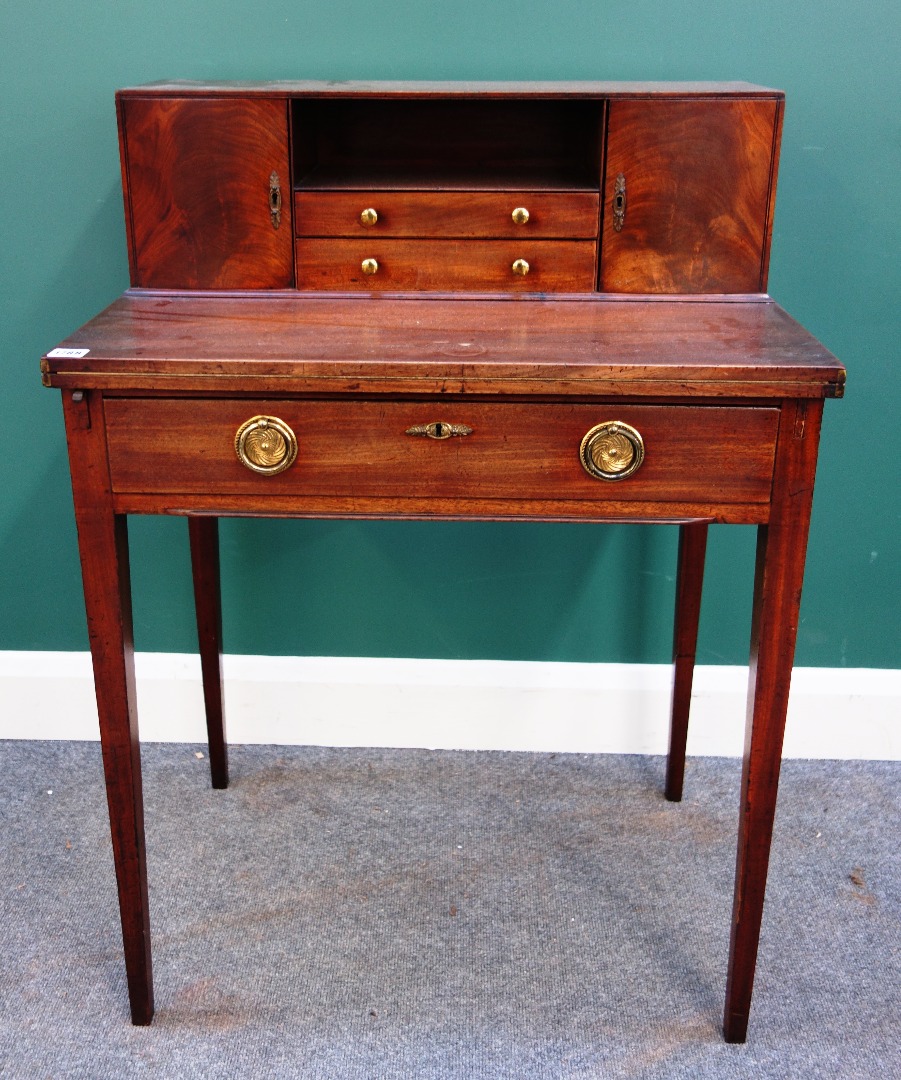 Appraisal: A George III mahogany lady's writing table with fold-out writing