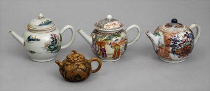 Appraisal: THREE CHINESE EXPORT PORCELAIN TEAPOTS AND COVERS AND A RELIEF-DECORATED