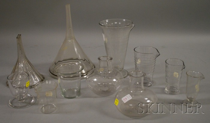 Appraisal: Eleven Pieces of Colorless Laboratory Glassware including measures funnels and