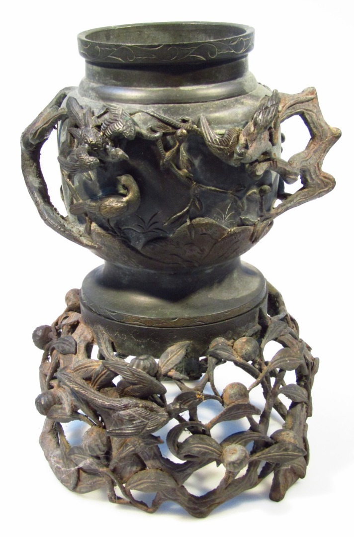 Appraisal: A thC bronze censer the circular body raised with various