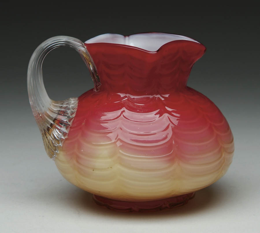 Appraisal: WHEELING DRAPE PATTERN CREAMER Beautiful raspberry red shading to creamy