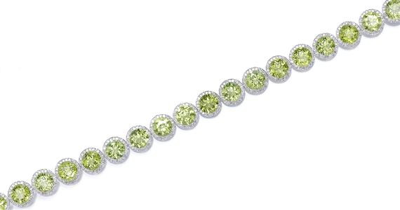 Appraisal: A PERIDOT AND DIAMOND BRACELET White gold Decorative bracelet composed