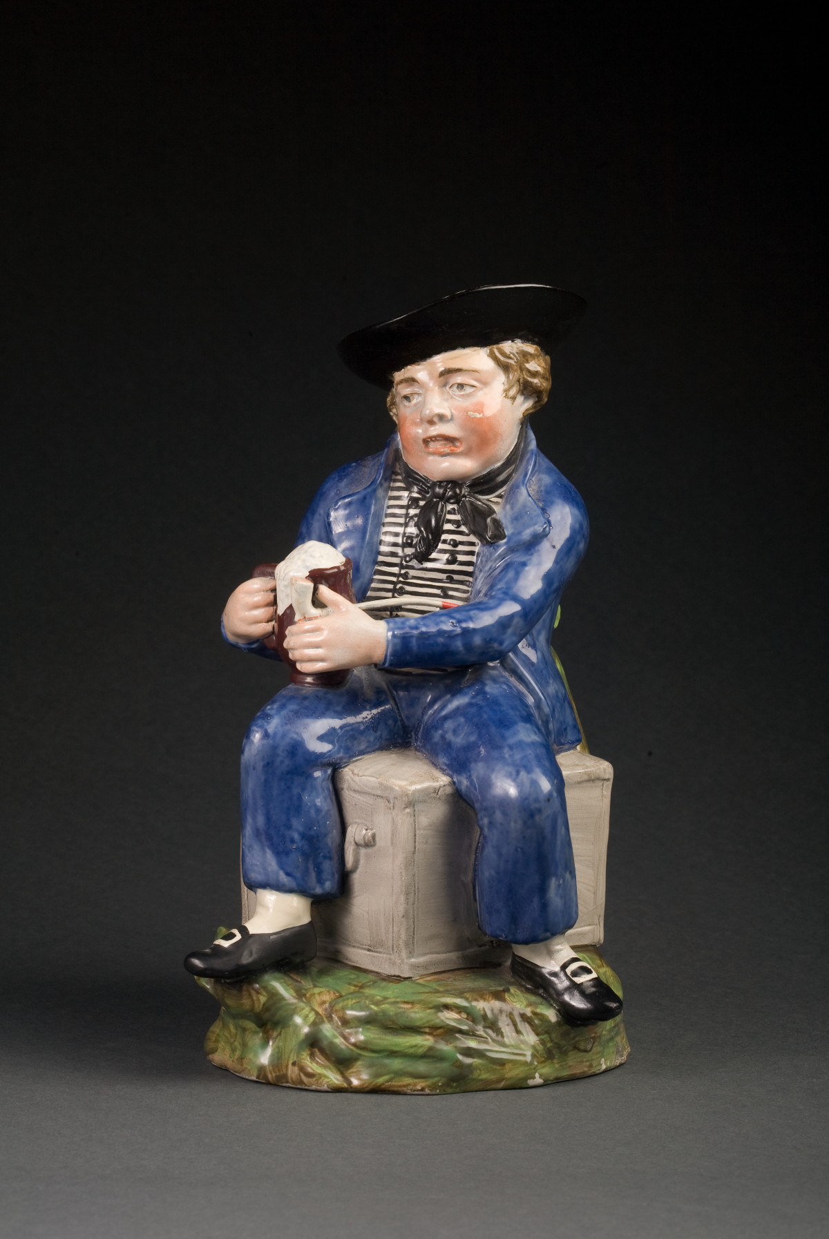 Appraisal: STAFFORDSHIRE PEARLWARE TOBY JUG IN THE FORM OF A JOLLY