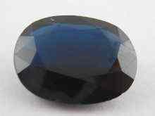 Appraisal: A loose polished oval sapphire measuring approx x mm weight