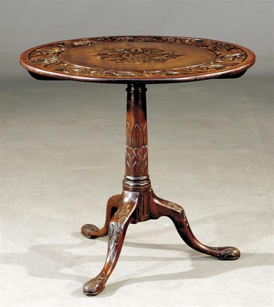 Appraisal: Georgian carved walnut tilt-top table first quarter th centurycircular form