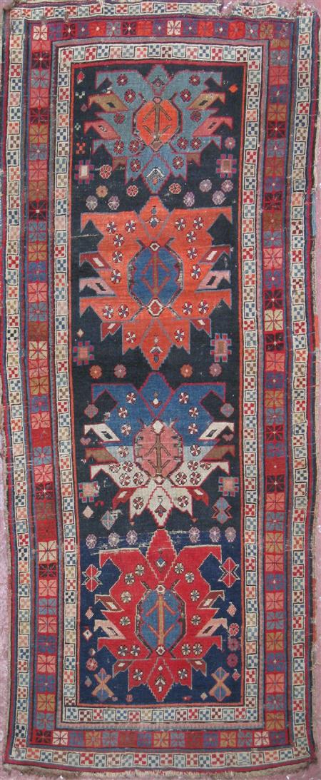 Appraisal: A Caucasian rug late th early th century the dark