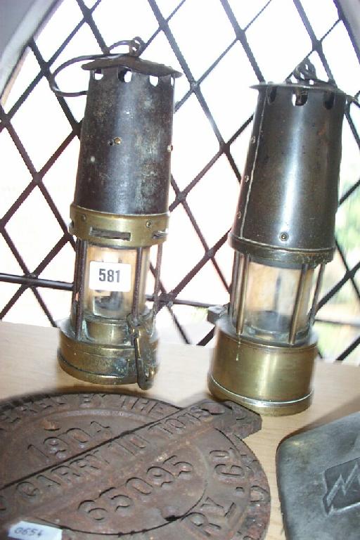 Appraisal: Two miners lamps one marked The Protector Lamp Eccles Manchester