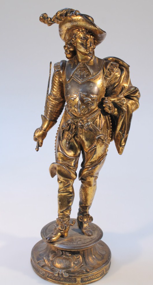 Appraisal: A thC cast metal figure of a Dumas style soldier