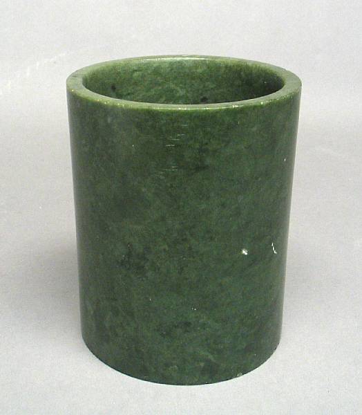 Appraisal: A green hardstone brush pot Qing Dynasty Of simple cylindrical