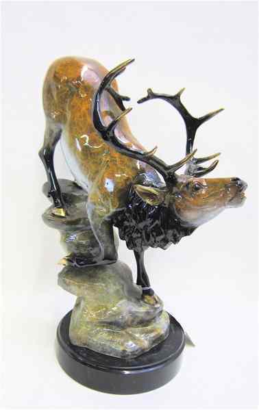 Appraisal: POLYCHROME BRONZE WILDLIFE SCULPTURE bull elk heading down a rocky