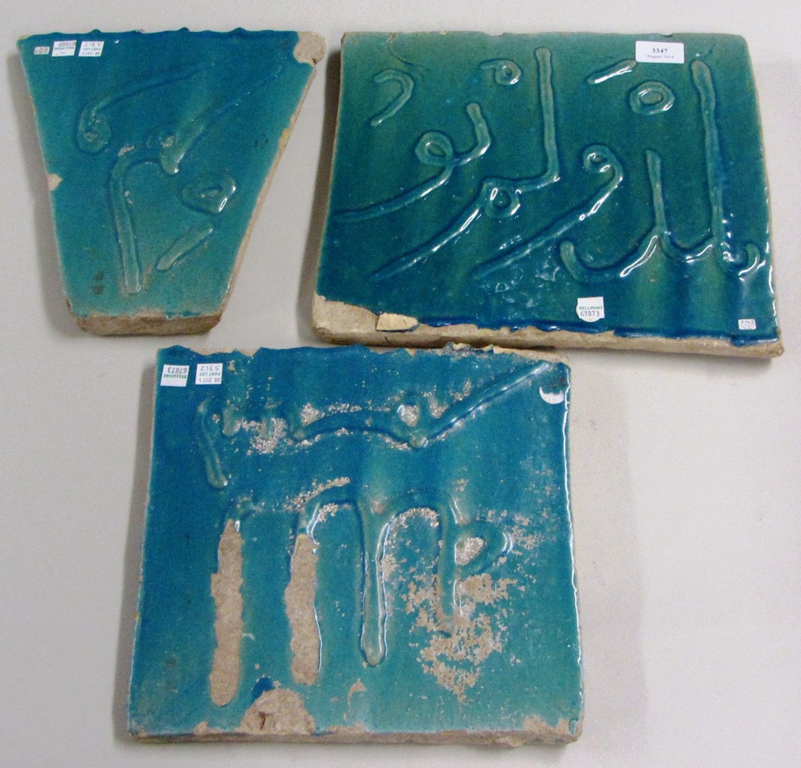 Appraisal: Three turquoise blue glazed calligraphic pottery tiles Iran circa th