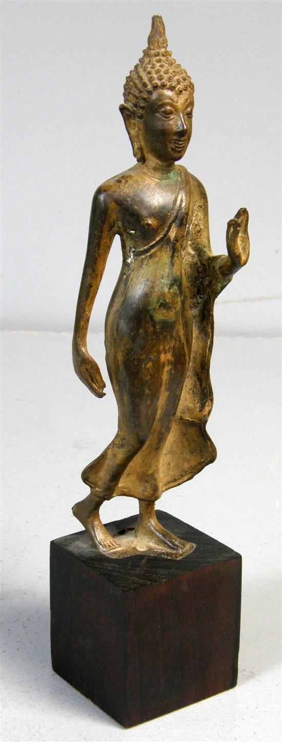 Appraisal: Eastern metal figure standing on a wood plinth h in