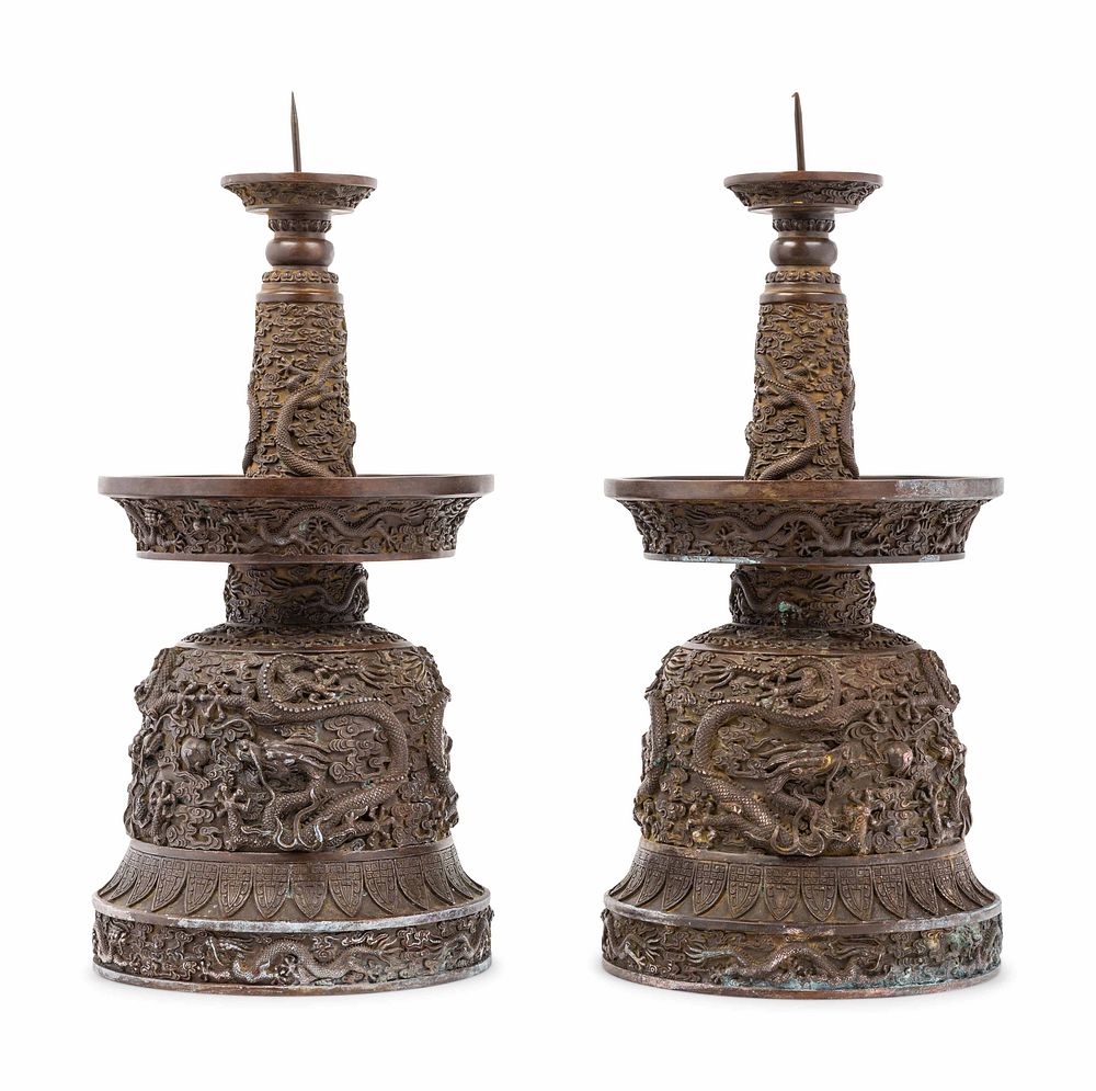 Appraisal: A Pair of Chinese Bronze Candle Holders A Pair of