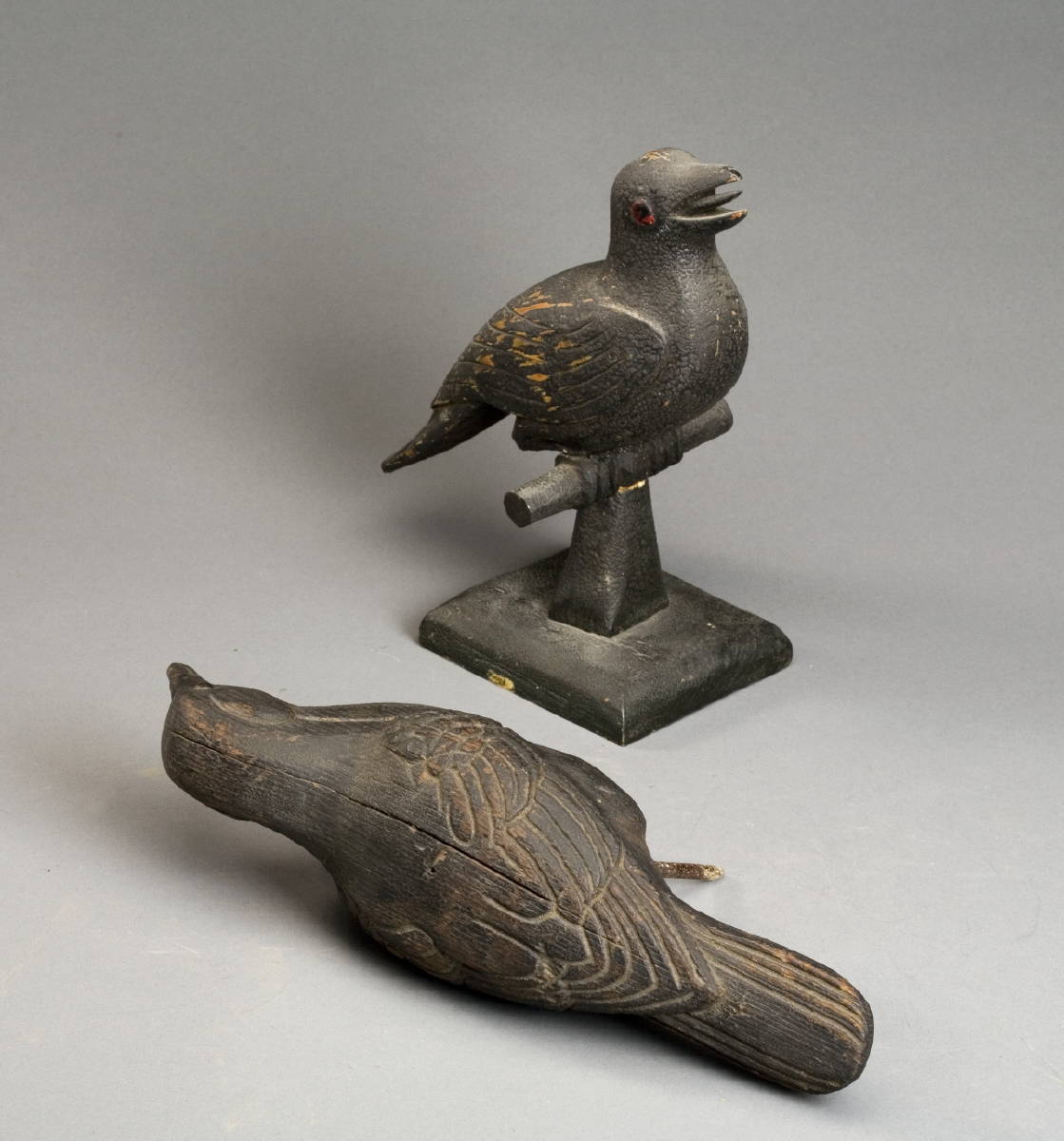 Appraisal: TWO CARVED AND PAINTED CROWS CIRCA One on a carved