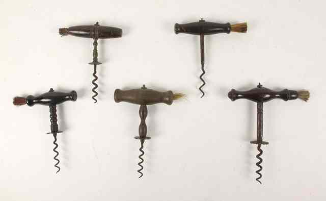 Appraisal: Five corkscrews with turned handles and brushes