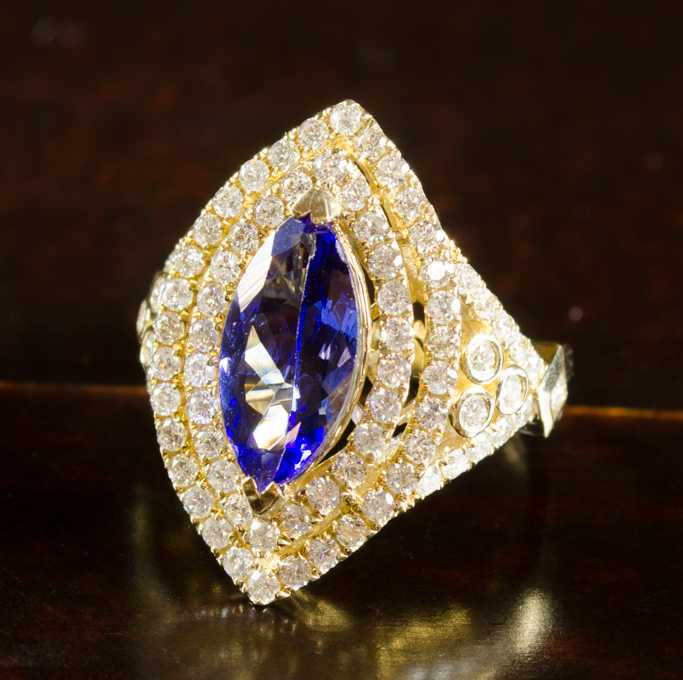 Appraisal: TANZANITE DIAMOND AND FOURTEEN KARAT GOLD RING with Global Gems