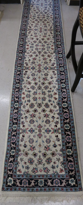 Appraisal: HAND KNOTTED ORIENTAL LONG RUG Indo-Persian overall floral decoration on