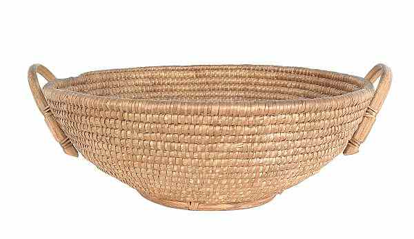 Appraisal: Pennsylvania rye straw basket th c with bentwood handles x