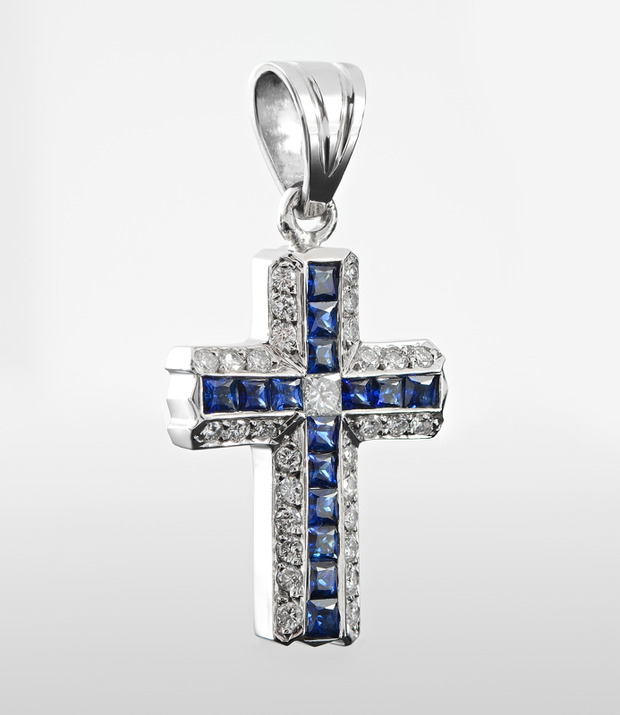 Appraisal: A FINE K DIAMOND SAPPHIRE CROSS PENDANT A shining display