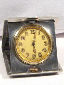 Appraisal: A silver travelling day clock dated