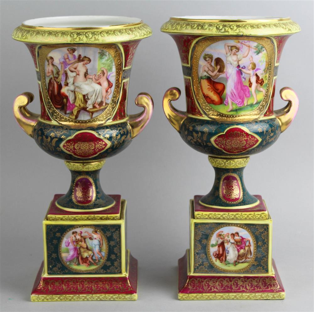 Appraisal: PAIR OF VIENNA STYLE CLARET AND GREEN GROUND PORCELAIN URNS