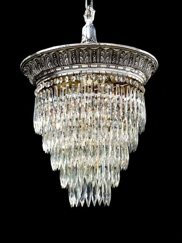 Appraisal: ART DECO CRYSTAL CHANDELIER Five tiers of crystal prisms hang