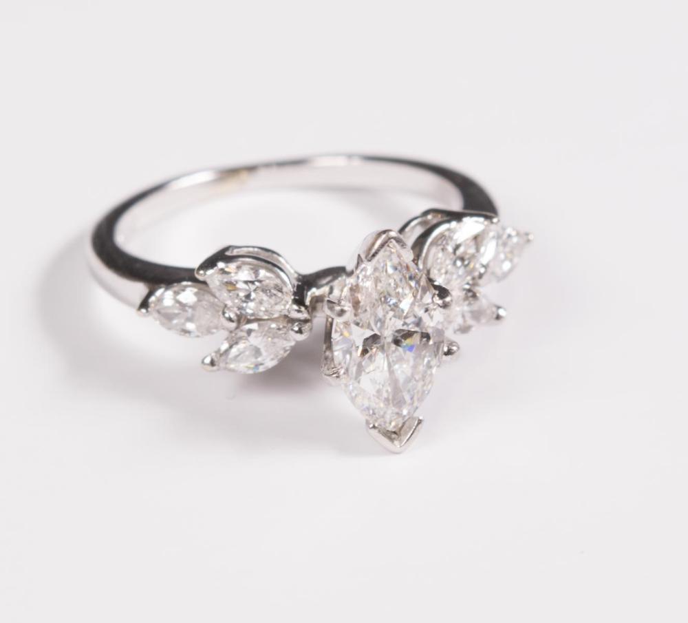 Appraisal: DIAMOND AND FOURTEEN KARAT WHITE GOLD RING with three round-cut