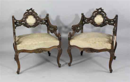 Appraisal: A pair of French carved beech low serpentine fauteuils on