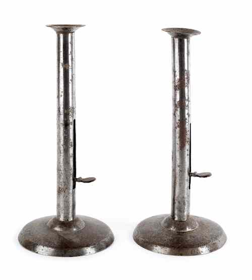 Appraisal: Pair of tall push-up hogscraper candlesticks th c h