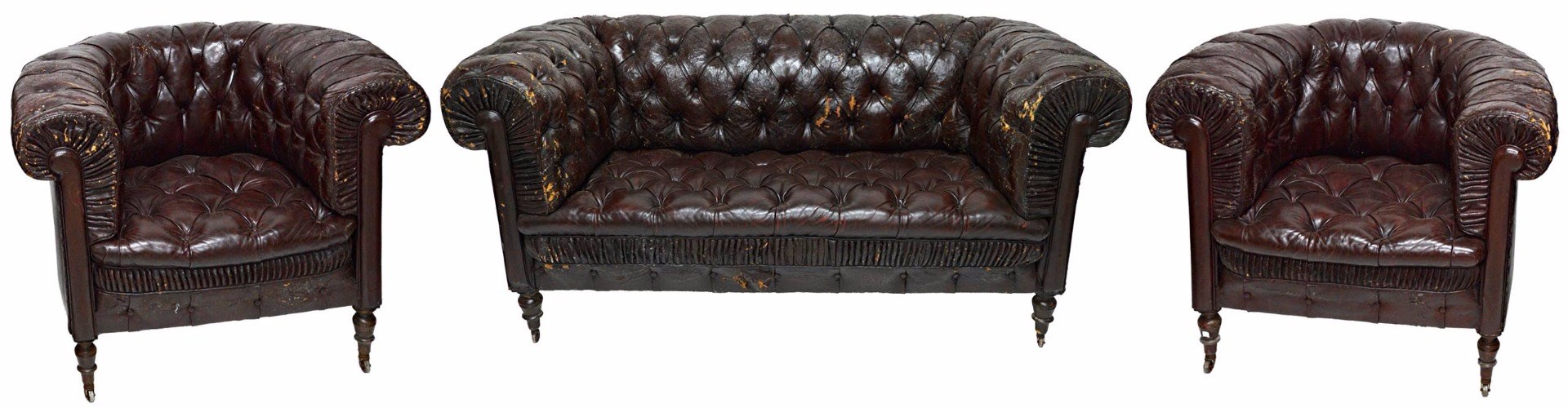 Appraisal: An early th century button back rouge leather upholstered Chesterfield