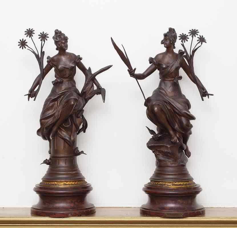 Appraisal: PAIR OF PATINATED SPELTER SCULPTURES AFTER MELSON Depicting females one