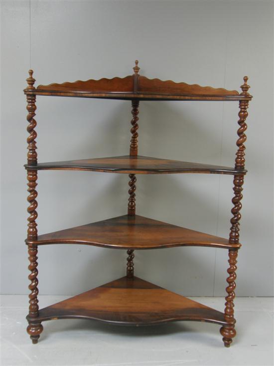 Appraisal: A Large Victorian rosewood serpentine shaped four tier corner whatnot