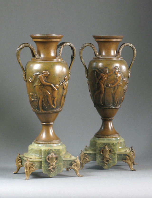 Appraisal: PAIR HEAVY SPELTER BRONZE-TONED URNS on shaped green marble bases