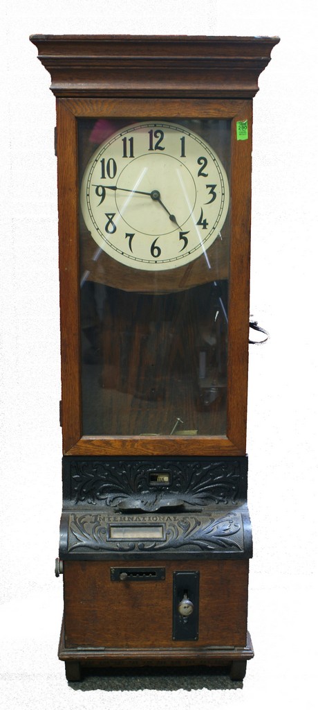 Appraisal: Oak International Time Recorder Clock hanging model cast iron fittings