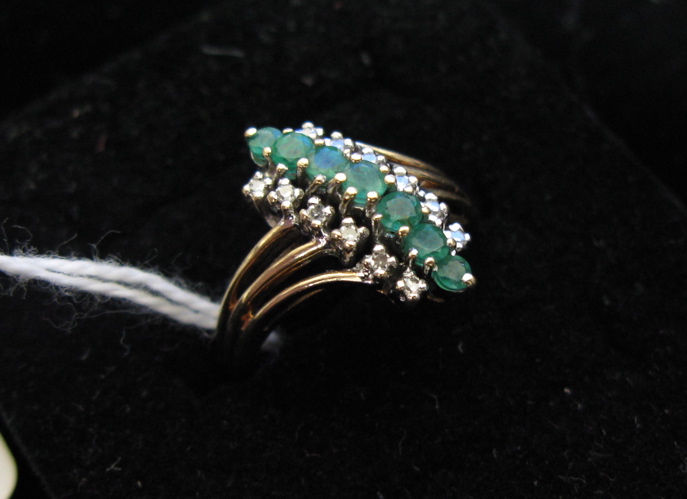 Appraisal: EMERALD DIAMOND AND TEN KARAT GOLD RING set with seven