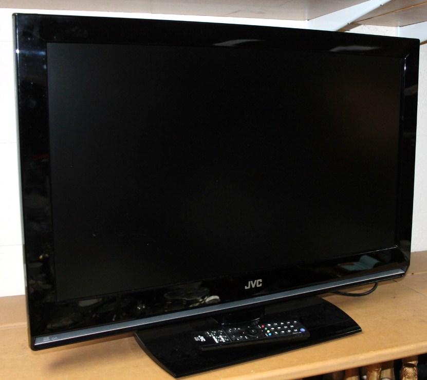 Appraisal: A JVC inch TV in black with remote control