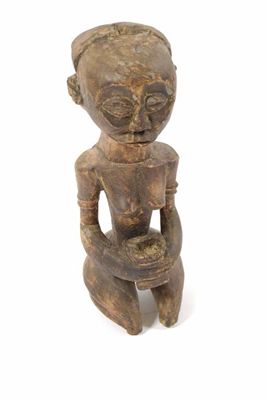 Appraisal: A Gabon kneeling female figure holding a pot in cm