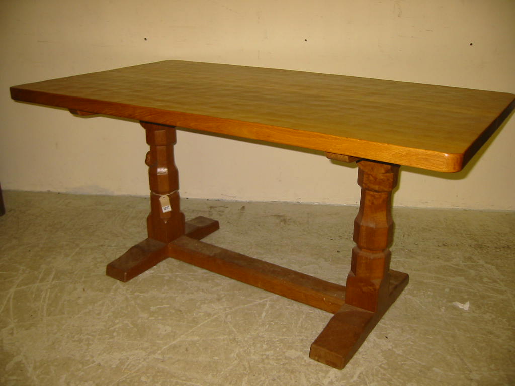 Appraisal: AN ADZED OAK REFECTORY STYLE DINING TABLE by Robert Mouseman