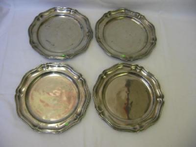 Appraisal: FOUR VARIOUS PEWTER PLATES of pentagonal wavy edged form th