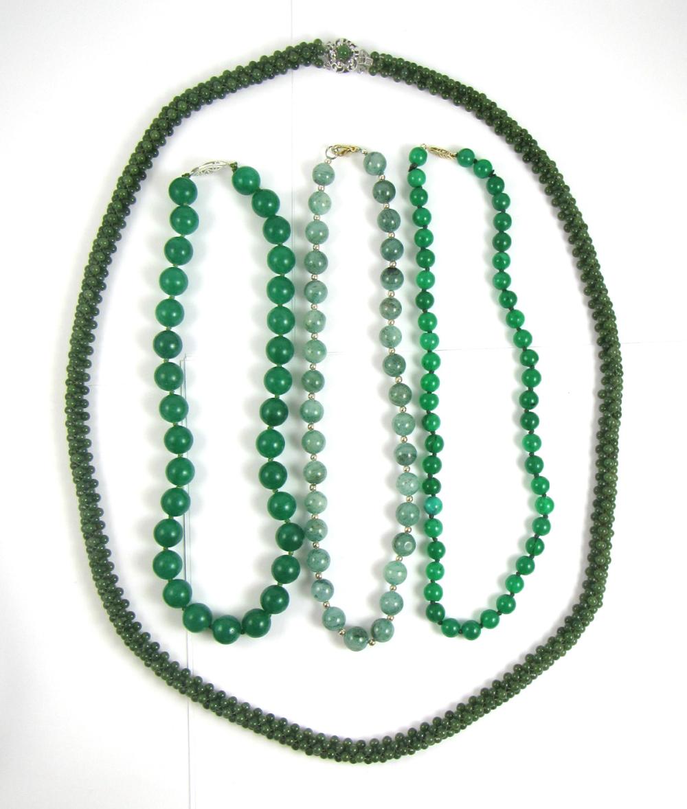 Appraisal: FOUR GREEN HARDSTONE BEAD NECKLACES including a - necklace with