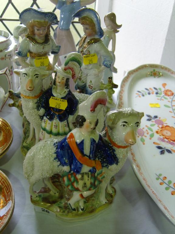 Appraisal: A pair of th century Staffordshire figure groups of a