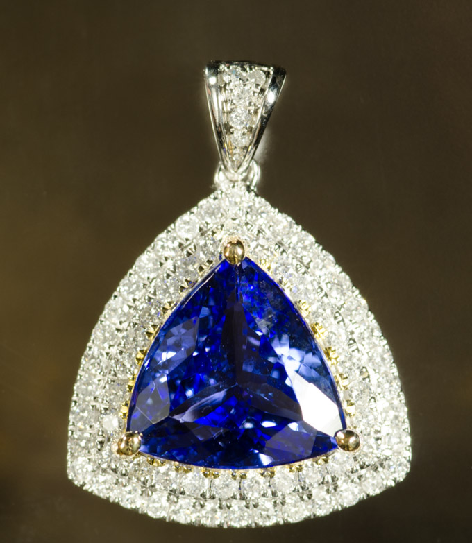 Appraisal: TANZANITE AND DIAMOND PENDANT k white gold with round-cut diamonds