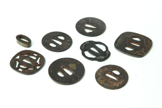 Appraisal: EIGHT SWORD FITTINGS Japan probably th century Seven iron tsuba