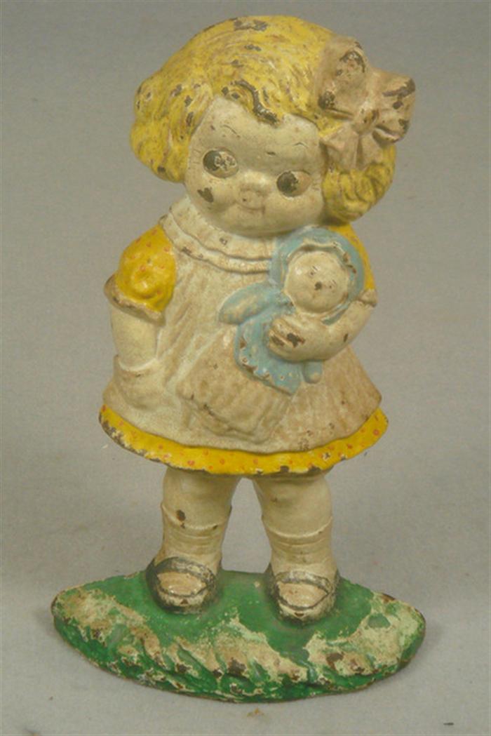 Appraisal: Cast iron doorstop hollow back little girl in yellow dress